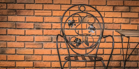 Alone Iron chair industrial design style on red brick wall background. decoration outdoor...