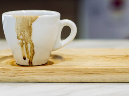 Dirty cup after drinking coffee . Empty used cup  . Hurry busy time . modern lifestyle in city .の写真素材
