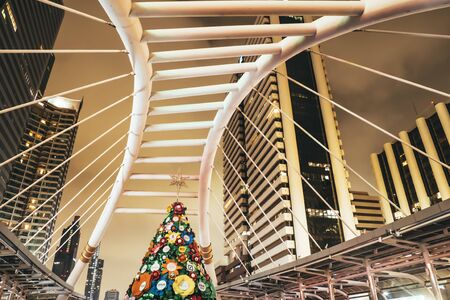 November 2019 Bangkok Thailand . Christmas trees made of Paper Eco friendly concept idea Accessories Ornaments Christmas with gift box on Christmas at skytrain station in Bangkok Thailandのeditorial素材