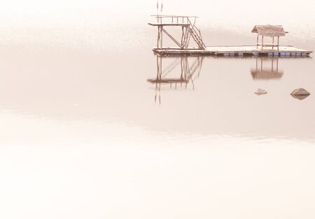 Wooden floating houses on  Lake in Sukhothai Thailand . blue sunrise in the lake . calm and peacefulness mind .clean Environment beautiful landscape background.Destination in Asiaの写真素材