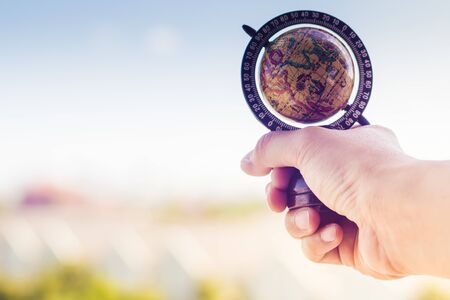 World in human hands. Sustain earth concept: Human hands holding global over blurred blue nature background.World environment day concept . Male hands holding the Earth globe on black background  holding globe earth .Environment concept idea. Exploration travel world lifestyle backgroundの写真素材