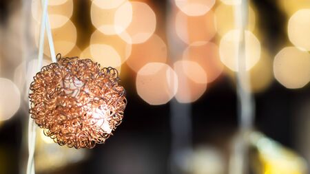 Woven Ball Globe Ceiling Pendant Light Lamp Shade .lampshade with fine workmanship and delicate .attractive and beautiful Perfect Decoration.selective focus blurred bokeh colorful backgroundの写真素材