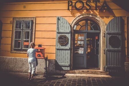 June 2016 Budapest Hungary a woman sending letter at the Old Post Office Buda Castle Districtの写真素材