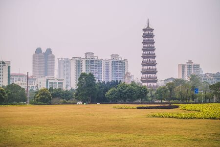 December 2019 Guangzhou China landscape urban design in city with scenic of high-rise building and main tourist attraction named The Temple of the Six Banyan Trees or Liurong Temple .の写真素材