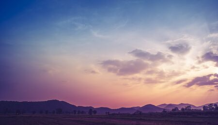 Panoramic rural landscape with mountains vast blue sky. Mountain ranges under blue sky and cloud.の写真素材