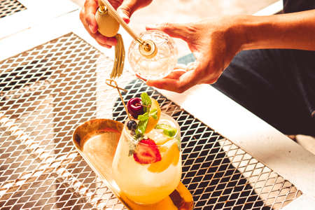 Glass of mock tail or cocktail. Serving Mock tail Glass mixed fruit non-alcohol cocktailの写真素材