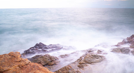 Long Exposure of Sea with Smooth Wave and Rock. Nature of Seascape abstract vacation travel in...
