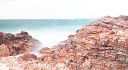 Long Exposure of Sea with Smooth Wave and Rock. Nature of Seascape abstract vacation travel in summer time.の写真素材