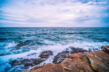Sea with Smooth Wave and Rock landscape. Nature of Seascape in vacation holiday travel relax time.の写真素材