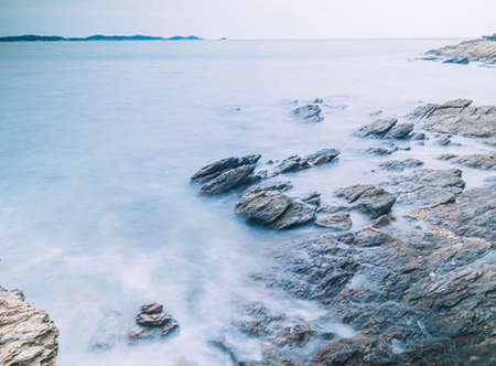 Long Exposure of Sea with Smooth Wave and Rock landscape. Nature of Seascape vacation holiday season time for relax travelの写真素材