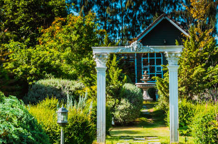 Stunning Entrance Portico Gate classic style decoration of a Public Garden. Column Stone structure element in classic architecture detailの写真素材