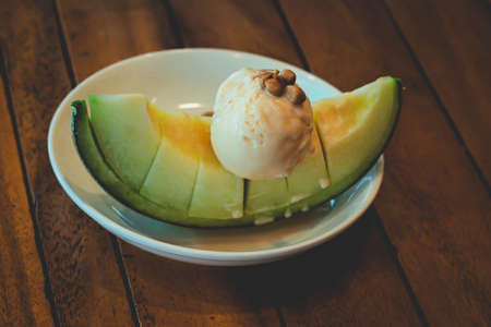 Fruity Melon dessert, topped with vanilla ice creamの写真素材