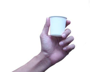 Hand  holding a paper cup of coffee Food delivery concept idea with clipping path isolate on white background.の写真素材