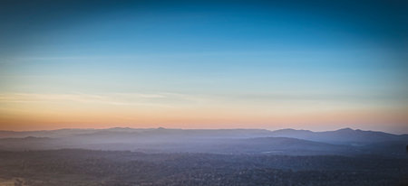 Panorama of a beautiful landscape with mountain ranges at sunset.  At Khao Yai National Park Thailandの写真素材