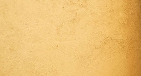 Abstract background from stucco concrete wall with sunlight, light and shadowの写真素材