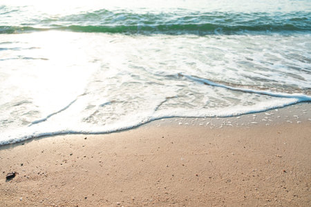 Close Up Wave Sand Beach Sea Foam.  Closeup of sea wave with foam on beach sand. Vacation Summer...