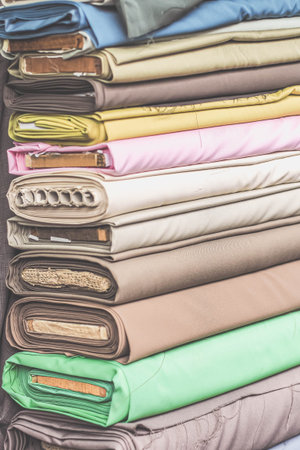 colorful fabric rolls in textile shop industry.Rolls of bright colored fabricの写真素材