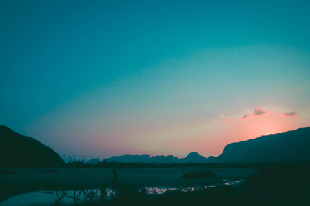 Panorama Sam Roi Yot mountain ranges layer landscape at sunset Thailand.の写真素材