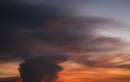 Giant dark cloud. Storm Clouds at Sunset abstract weather season.の写真素材