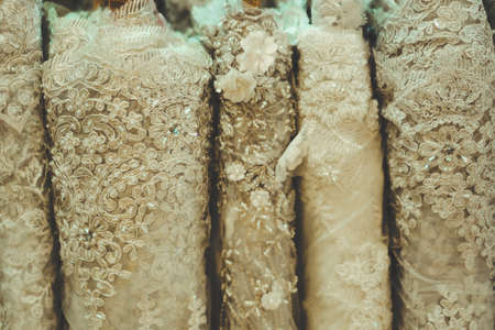 colorful lace fabric rolls in textile shop industry manufacture material.の写真素材