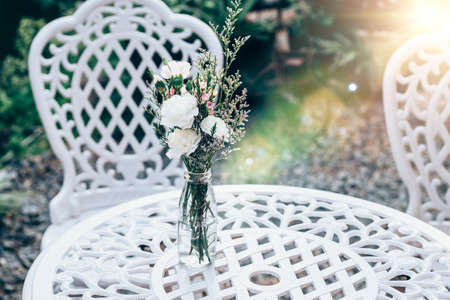 Morning sunlight in summer with A nice collection of garden decorations in whiteの写真素材