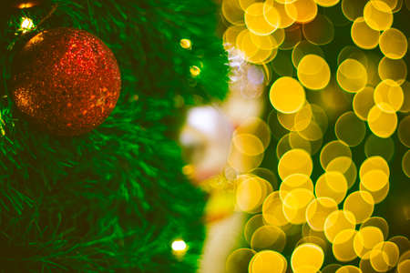 Close up red Christmas ball decoration on bokeh background. Colorful blur bokeh background. christmas backgroundの写真素材