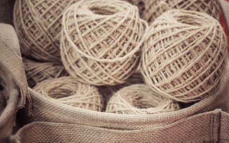 Winding the hand ball of string rope cotton in basket material handmade craftの写真素材