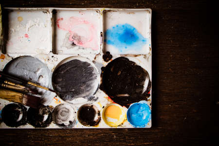 Christmas golden bell decoration on yellow background. Colorful blur bokeh background. Christmas backgroundの写真素材