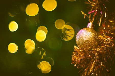 Christmas ball decoration on yellow background. Colorful blur bokeh background. christmas backgroundの写真素材