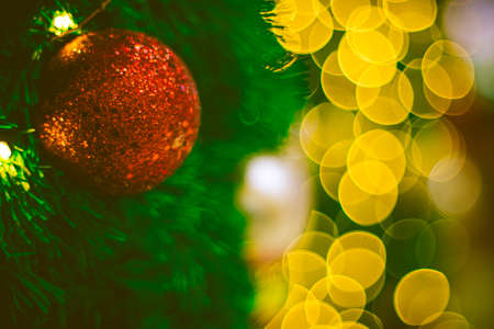 Close up red Christmas ball decoration on bokeh background. Colorful blur bokeh background. christmas backgroundの写真素材