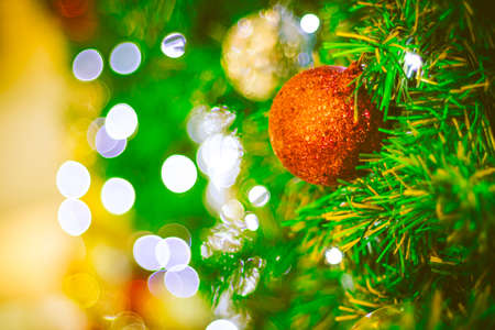 Close up red Christmas ball decoration on bokeh background. Colorful blur bokeh background. christmas backgroundの写真素材