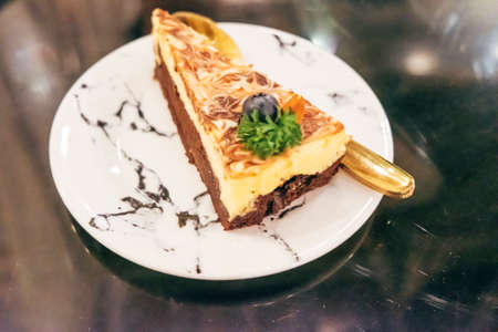 Slice vegan chocolate almond cheese cake delicious dessert food cuisine.の写真素材