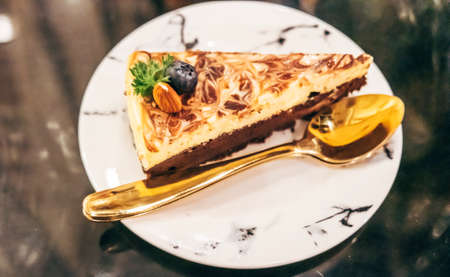 Slice vegan chocolate almond cheese cake delicious dessert food cuisine.の写真素材