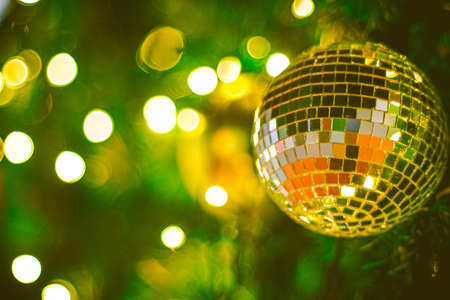 Christmas glitter ball decoration on bokeh background. Colorful blur bokeh background. christmas backgroundの写真素材