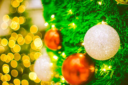 Close up red Christmas ball decoration on bokeh background. Colorful blur bokeh background. christmas backgroundの写真素材
