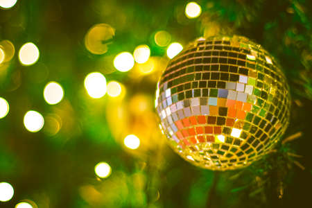 Christmas glitter ball decoration on bokeh background. Colorful blur bokeh background. christmas backgroundの写真素材