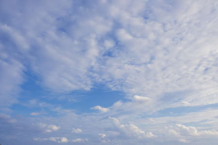 Beautiful white fluffys clouds sky background with blue sky backgroundの写真素材