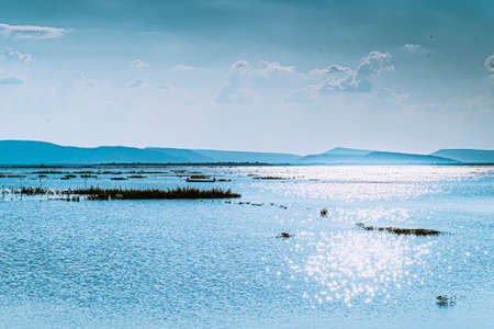 Mountain lake with perfect of blue ocean beautiful landscape with glitter light  reflected in water. Nature lake landscapeの写真素材