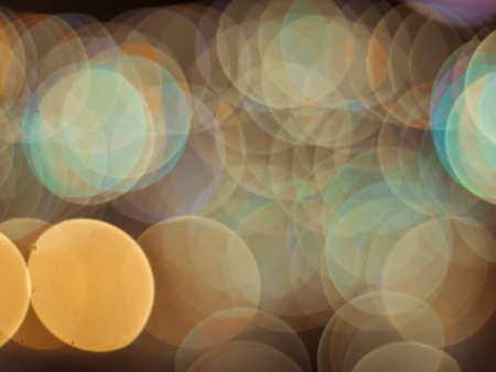 Defocused light source Gold yellow Bokeh Colorful abstract blur background.の写真素材