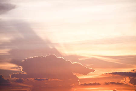 Beautiful sunset sky above clouds orange sunset sky. Beautiful sky. Dramatic red yellow pastel color at sunset.の写真素材