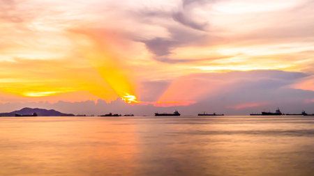 A golden sunrise or sunset over the ocean. Sunset, Sunrise Summer Landscape. Beautiful Nature.の写真素材