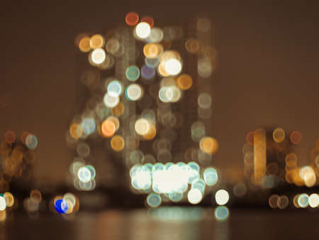 Defocus blur city night lights colorful bokeh abstract capital city architecture background.の写真素材