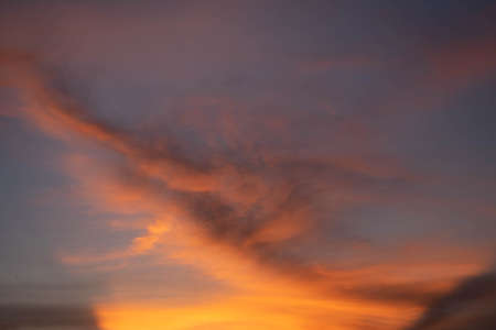 Beautiful sunset sky above clouds orange sunset sky. Beautiful sky. Dramatic red yellow pastel color at sunset.の写真素材
