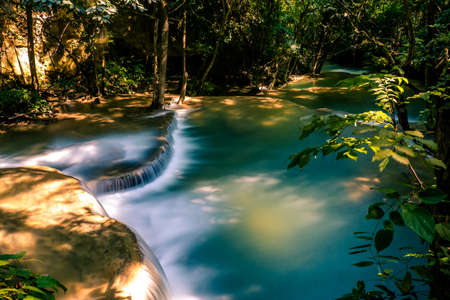 Long exposure exotic beautiful tropical deep rainforest waterfall Fresh turquoise waterfalls in deep forest of Huay Mae Khamin waterfall in the national park Beautiful landscape waterfalls.の写真素材