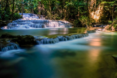 Long exposure exotic beautiful tropical deep rainforest waterfall Fresh turquoise waterfalls in deep forest of Huay Mae Khamin waterfall in the national park Beautiful landscape waterfalls.の写真素材