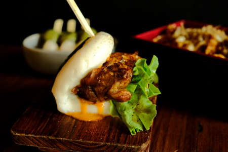 Hirata buns.  Japanese steamed buns filled with pork chashu, tempura, karaage. Japanese traditional foodの写真素材