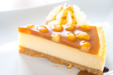 macadamia caramel cake on a plate cuisine dessert sweet food.の写真素材