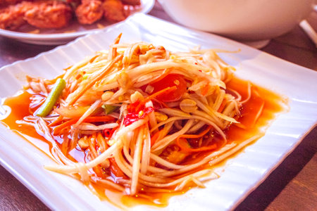 Som Tum - Thai Spicy Green Papaya Salad: A Burst of Flavors from Thailandの写真素材