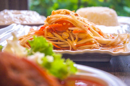 Som Tum - Thai Spicy Green Papaya Salad: A Burst of Flavors from Thailandの写真素材