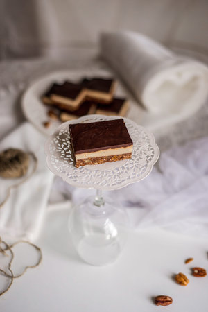Very appetizing beautiful food photo of tasty chocolate authentic canadian dessert Nanaimo with nuts...